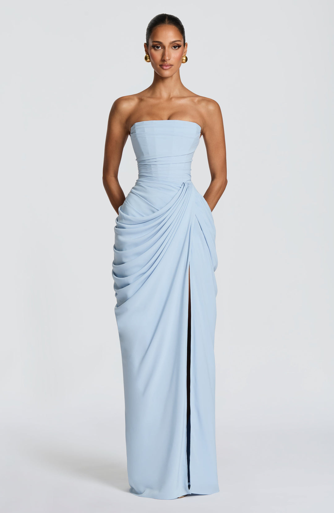Sophisticated women's strapless evening gown, a corset maxi dress with elegant high slit for special occasions.