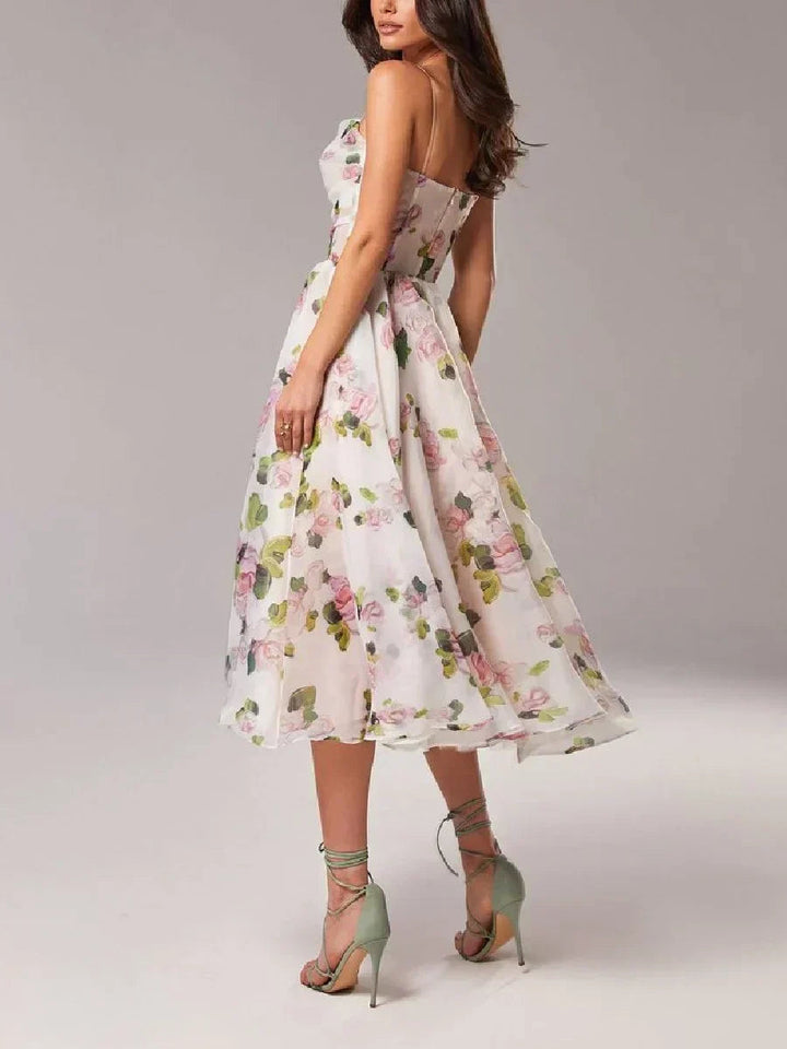 Women's elegant strapless party dress featuring beautiful floral print. A sophisticated cocktail gown.