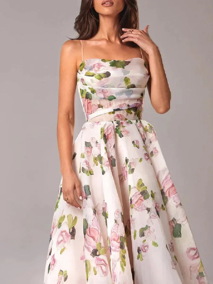 Structured women's formal strapless dress with a vibrant floral pattern. Elegant choice for evening events.