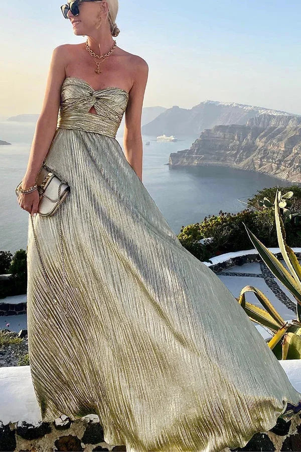 Women's celebration wear: a beautiful strapless pleated maxi dress for an elegant party look.