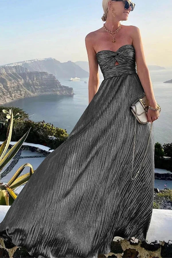 Elegant women's evening dress, a flowy strapless maxi with delicate pleats for formal events.