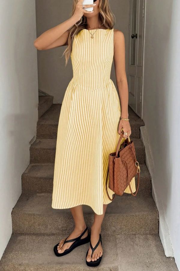 Chic women's striped pleated midi dress with a halter neck, ideal for vacation, beach, or summer parties.