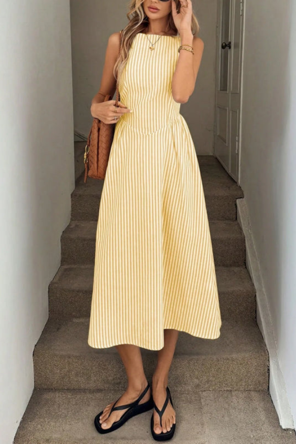 Flowy striped pleated halter neck midi dress for women, offering a comfortable and elegant summer style.
