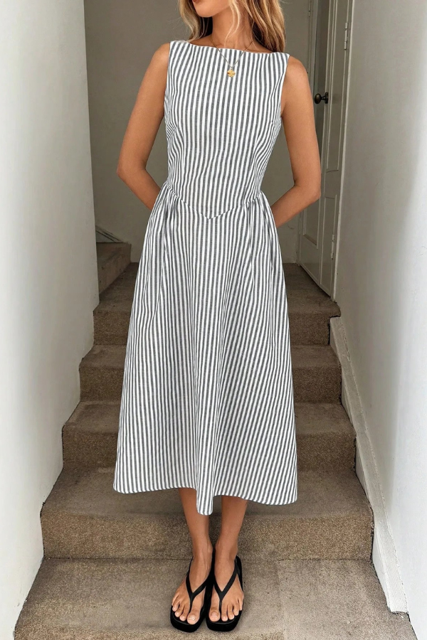 Fashionable women's striped pleated halter neck midi dress, a stunning choice for any summer party or event.