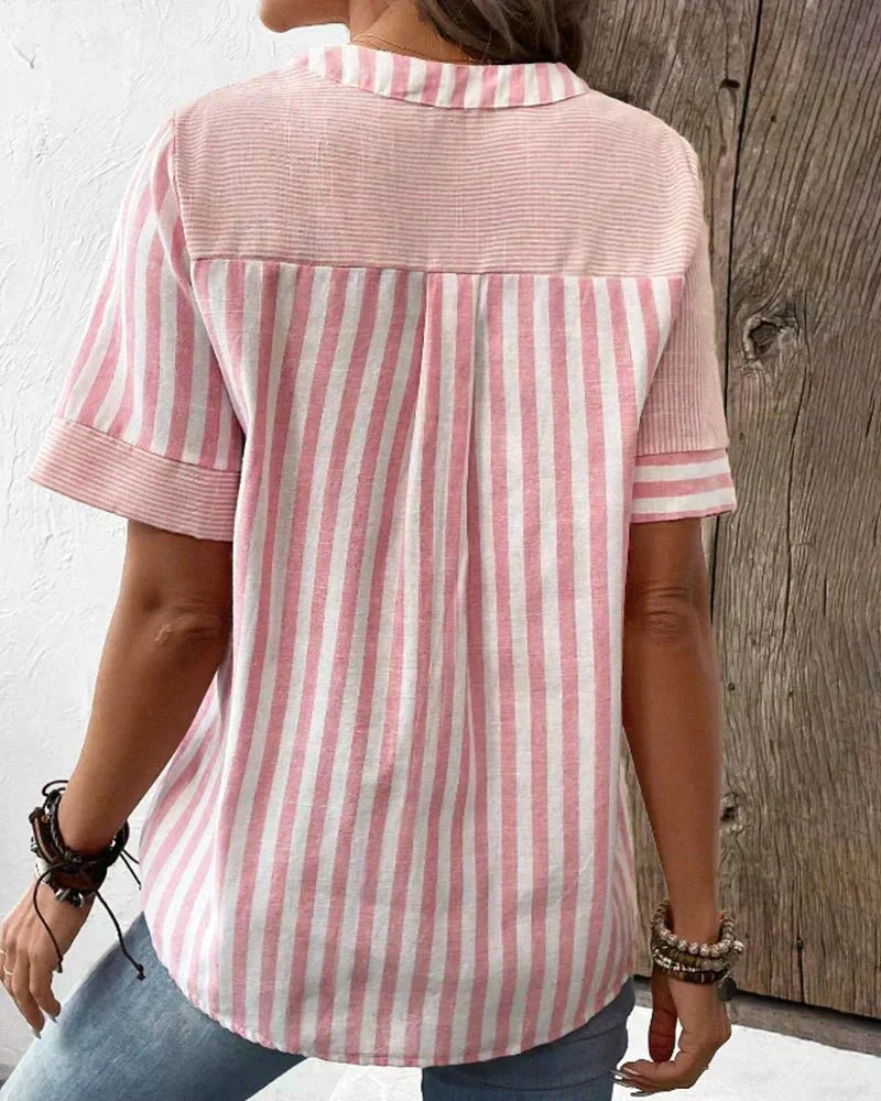 Fashionable women's striped short sleeve blouse. Elegant short sleeve top, versatile for casual or dressy occasions.