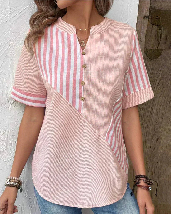 Stylish women's striped short sleeve blouse. Flattering and comfortable top for work, office, or casual outfits.