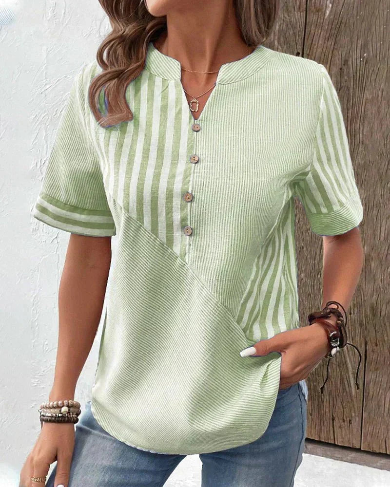 Classic women's striped short sleeve blouse. Elegant short-sleeve top, versatile for spring/summer fashion looks.
