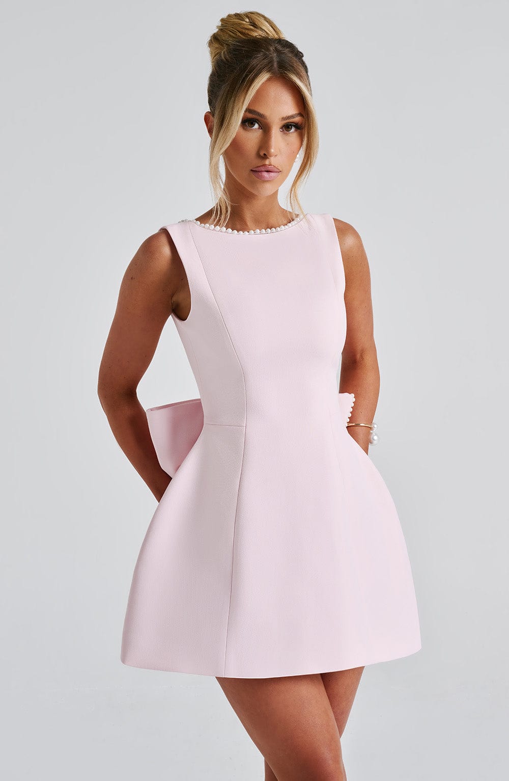 Elegant women's structured mini dress, perfect for parties & sophisticated events. Tailored for a chic look.