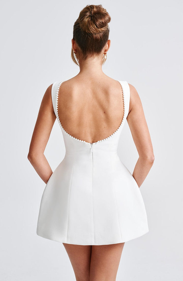 Fashionable women's structured cocktail dress; a modern mini dress design. Perfect for parties, evening, & style.