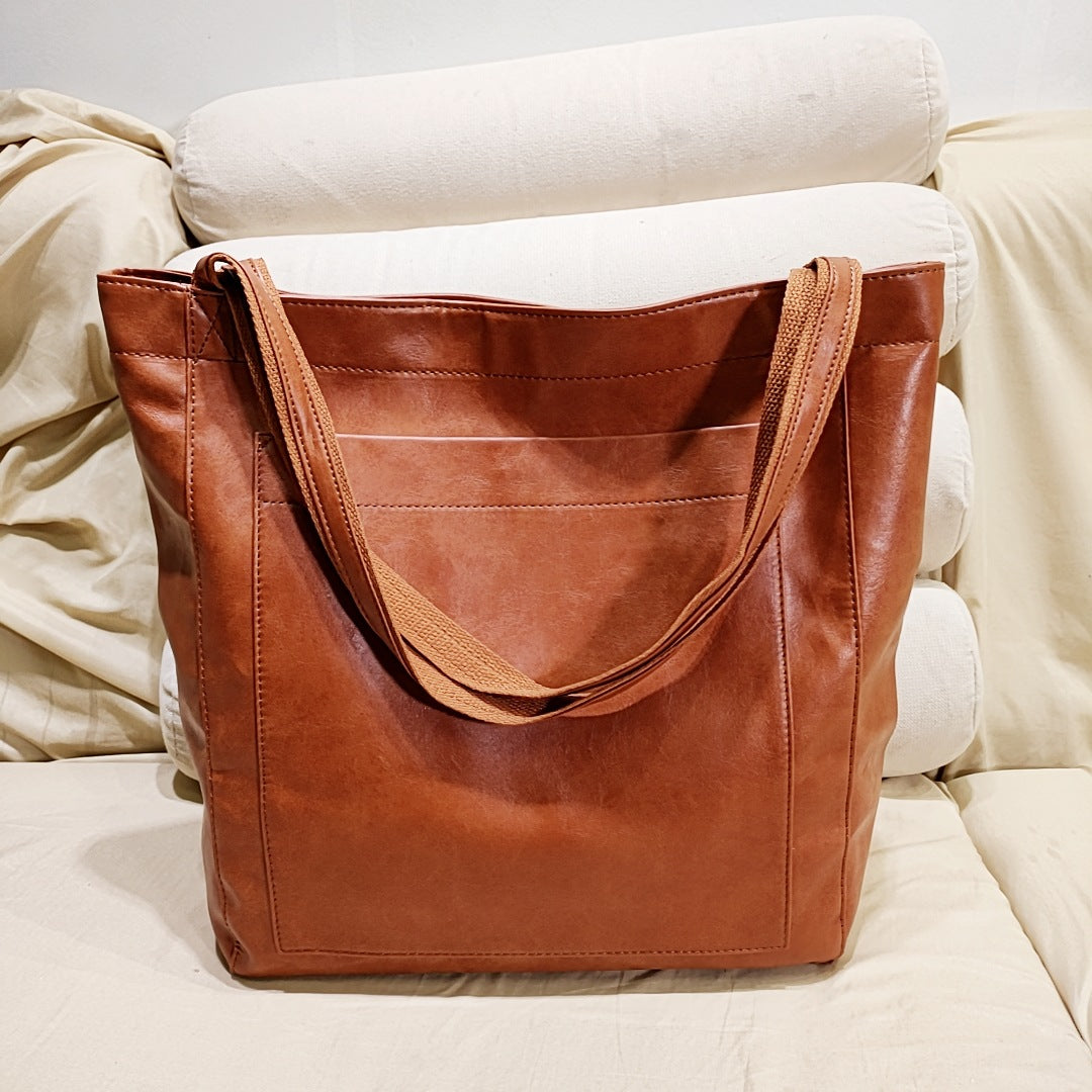 Elegant women's structured tote handbag with top handles & shoulder strap. Perfect versatile everyday fashion accessory.
