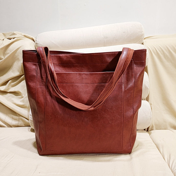 Stylish structured tote bag for women, featuring shoulder & crossbody straps. A versatile everyday satchel.