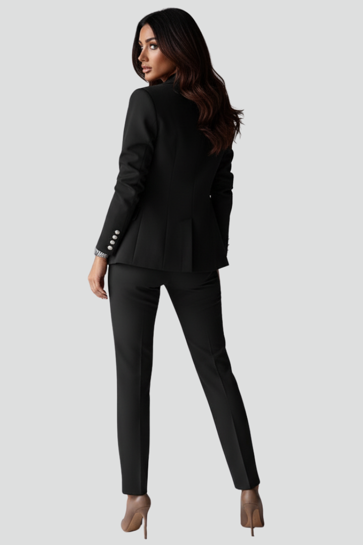 Complete women's power suit featuring a chic blazer & straight trousers. Defines professional and elegant style.