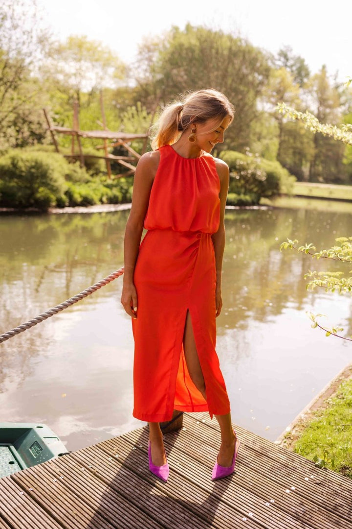 Close-up of adjustable straps on an elegant women's summer midi dress, ensuring a perfect fit.
