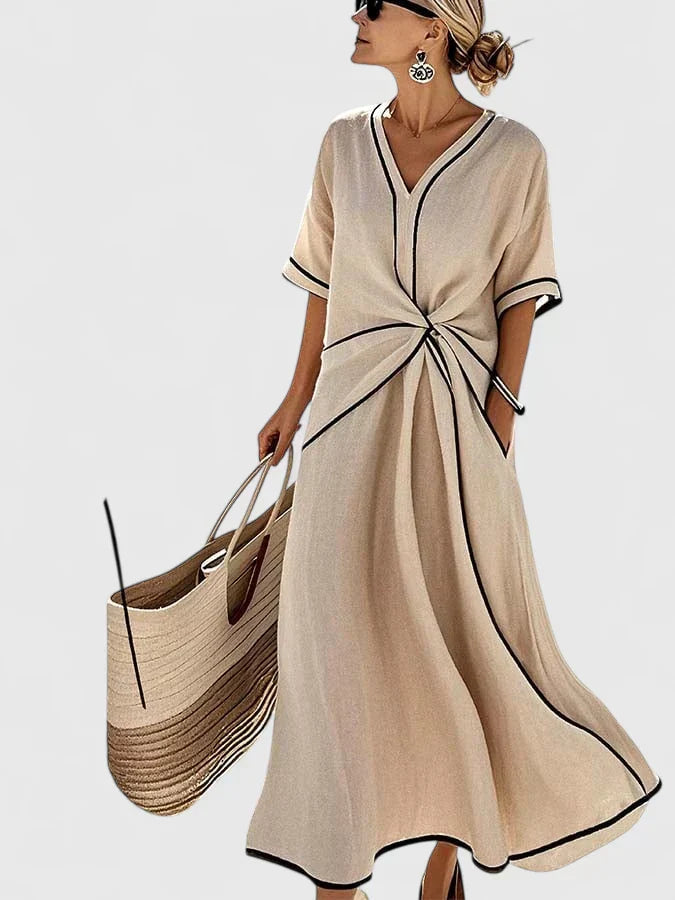 Stylish women's short sleeve V-neck midi dress, featuring a chic twist-front design, ideal for spring or summer occasions.