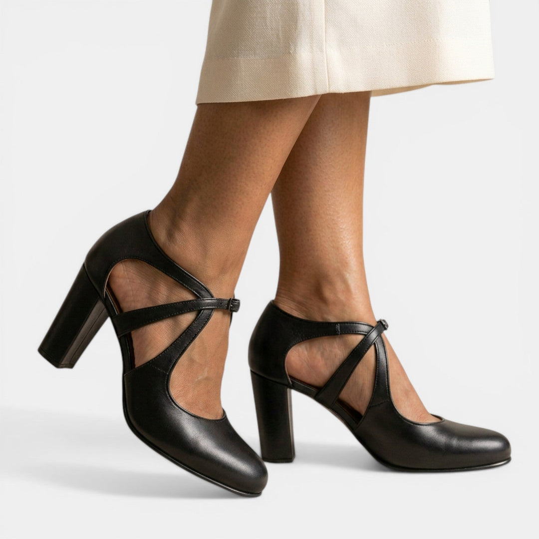 Women's elegant T-strap high heel sandals on a foot, demonstrating comfort and chic style.