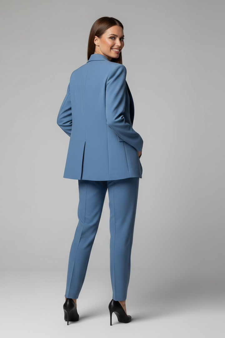 High-quality women's blue blazer and tailored trousers suit, designed for elegant professional wear & office style.