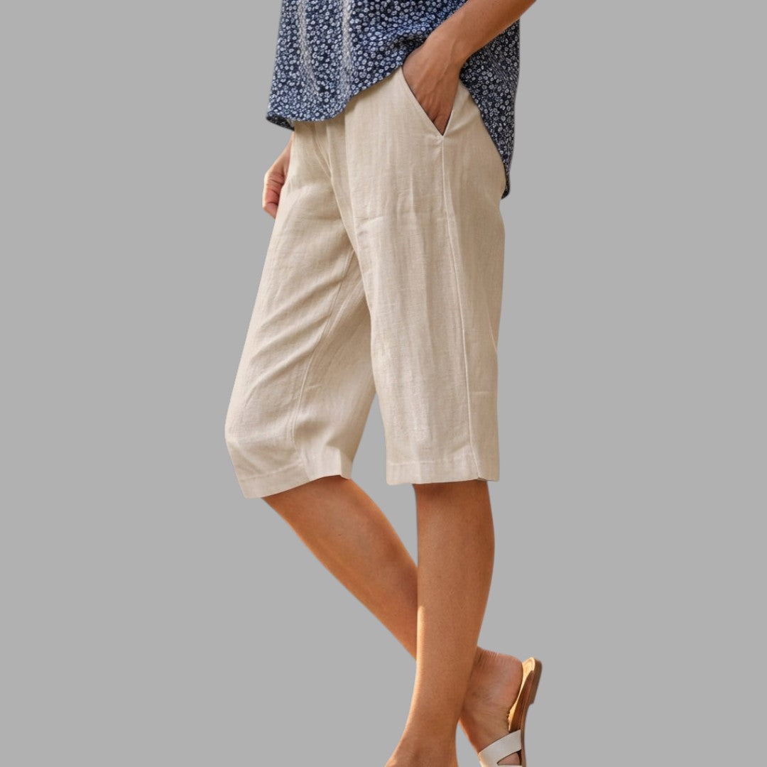 Women's tailored knee-length shorts, offering a sophisticated look for smart casual and elegant summer wear.