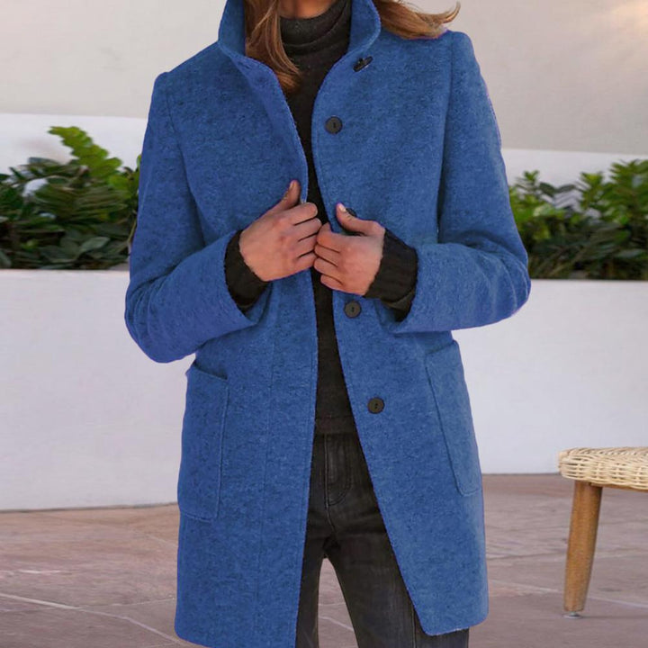 Women's tailored mid-length work coat with button front, ideal for professional autumn & winter office wear & elegance.