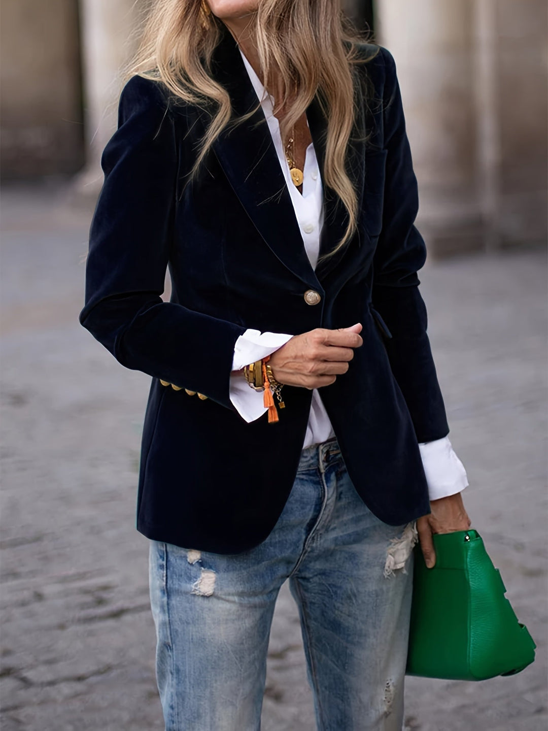Chic velvet blazer for women, tailored fit with eye-catching gold buttons, ideal for office or events.