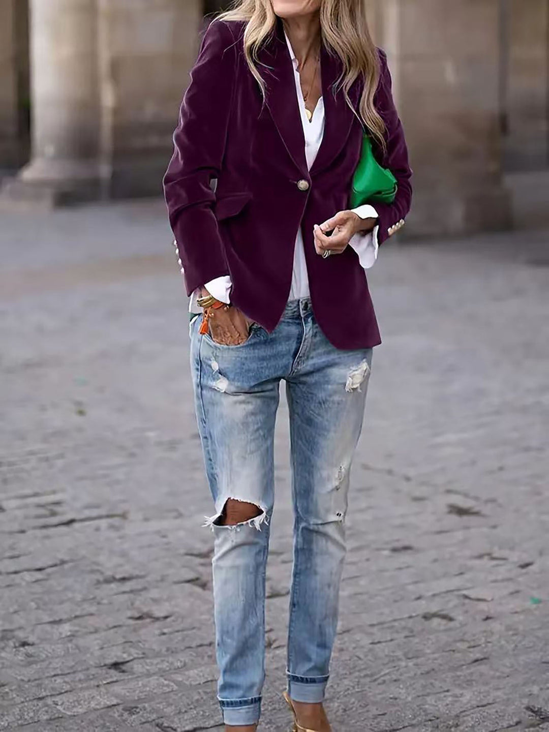 Fashion-forward women's tailored velvet blazer. This chic jacket has detailed gold buttons & a sleek design.