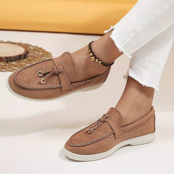 Elegant women's tassel loafers, perfect for office or casual chic sophisticated style. Comfortable slip-on shoes.