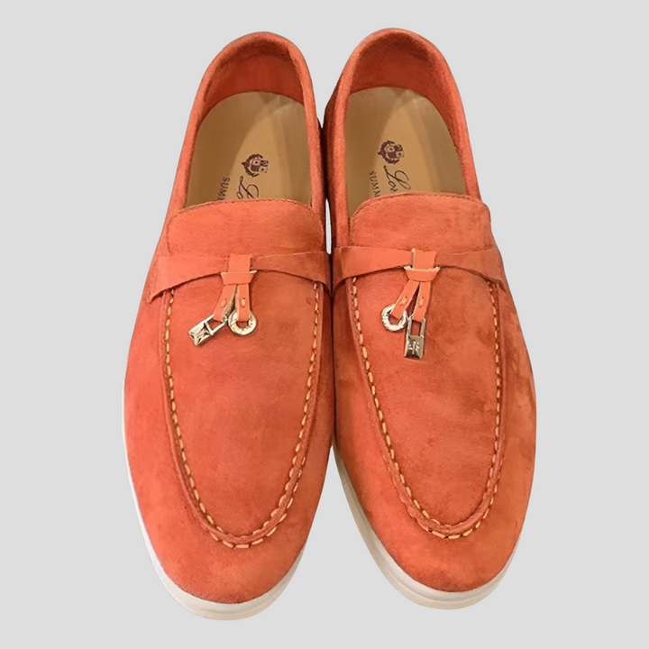 Sophisticated women's slip-on loafers with elegant tassels, a classic footwear choice for ladies seeking comfort.