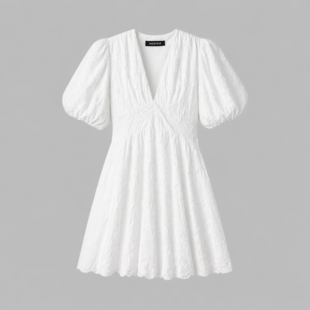 Textured women's floral midi dress with a chic V-neck & puff sleeves, ideal as a stylish day or occasion dress.