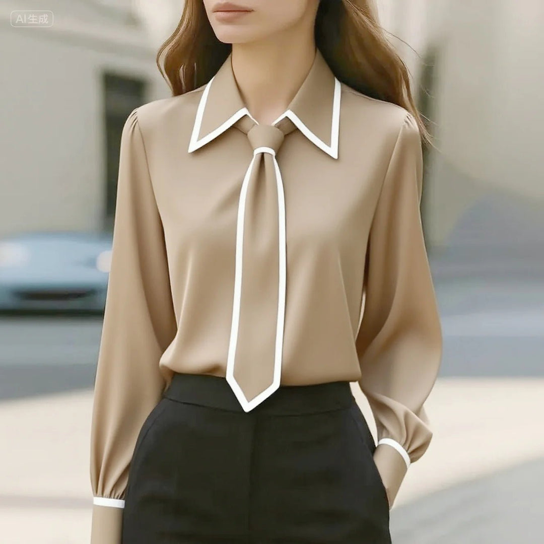 Professional long sleeve women's blouse featuring a stylish tie neck and contrast trim; ideal for office wear.