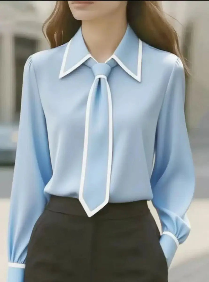 Chic women's button-down blouse with a sophisticated tie neck, long sleeves, and elegant contrast trim detail.