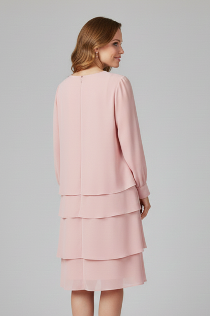 Modest women's tiered long sleeve knee-length dress in a solid color, offering casual elegance & comfort.