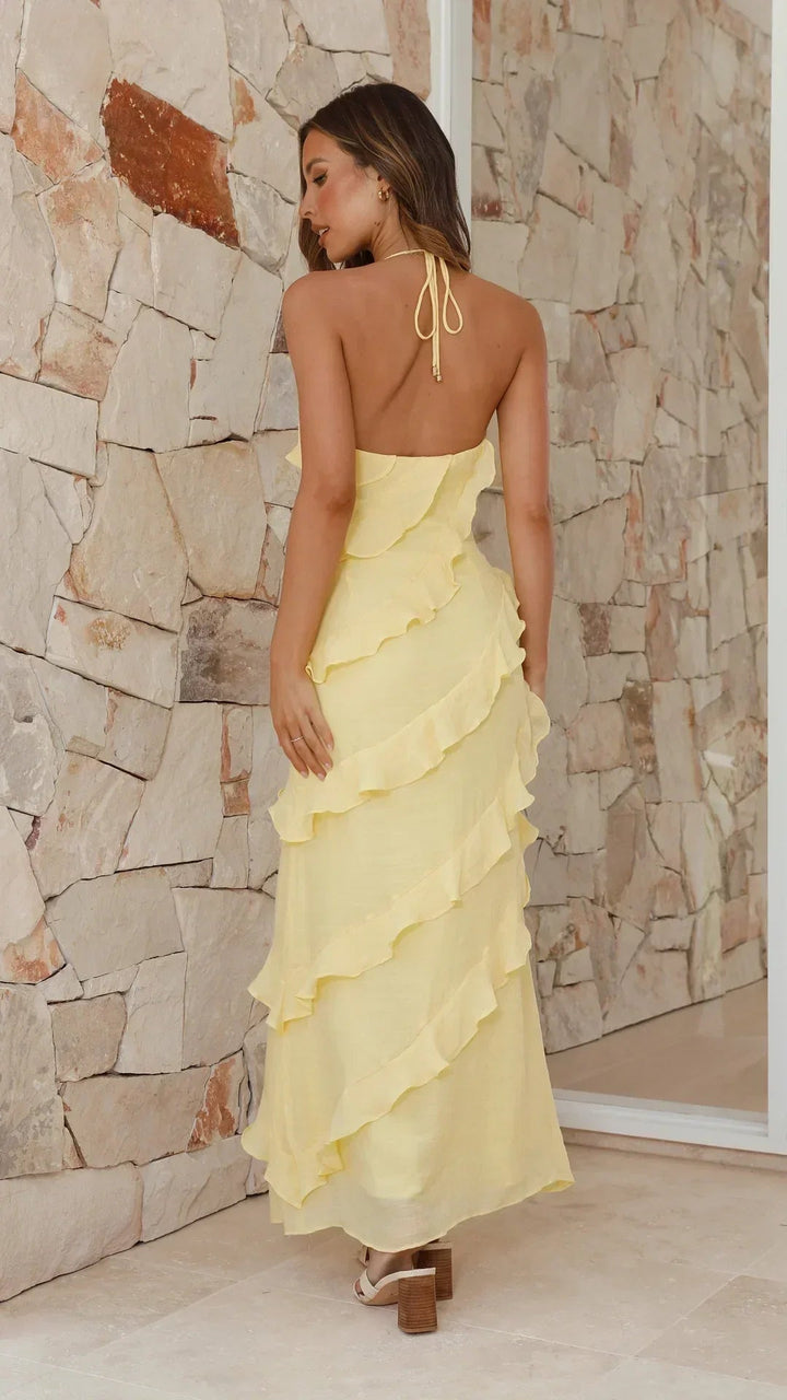 Flowy sleeveless tiered ruffle maxi dress for women, ideal for elegant summer style or garden parties.