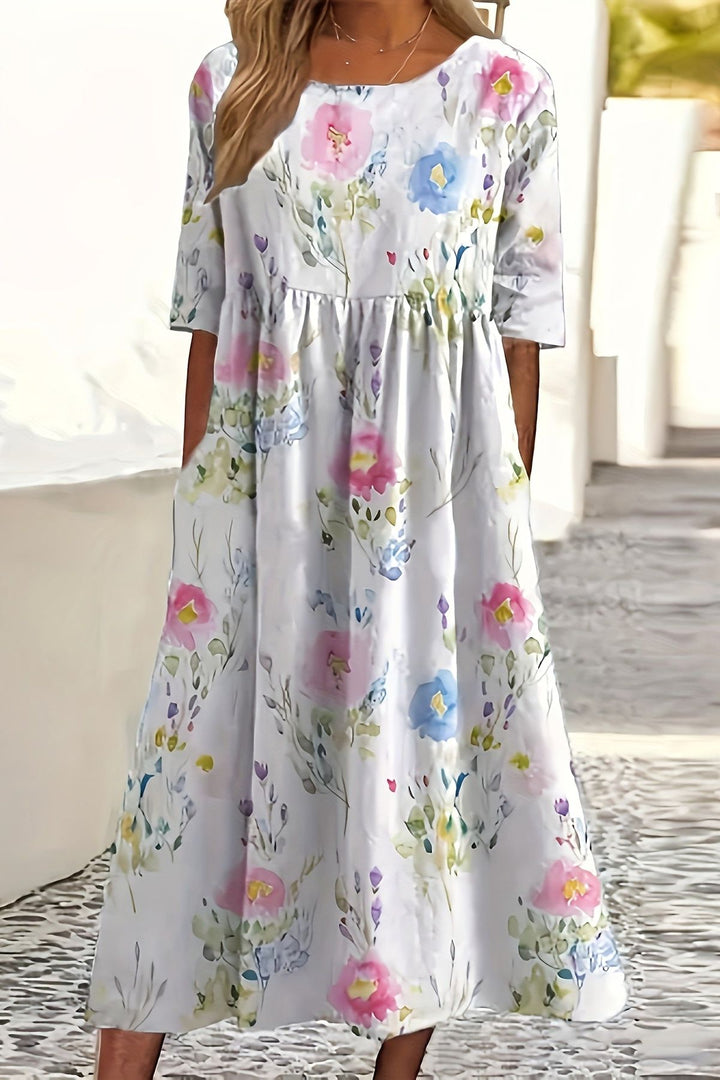 Elegant women's tiered ruffle midi dress, perfect for summer. Features a flowy, relaxed fit for comfortable casual wear.