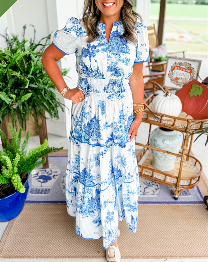 Women's tiered toile print maxi dress with an elegant V-neck and flattering smocked waist. Casual spring style.