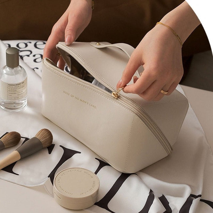 Pink elegant travel makeup organizer bag, perfect portable cosmetic beauty case for women's essentials.