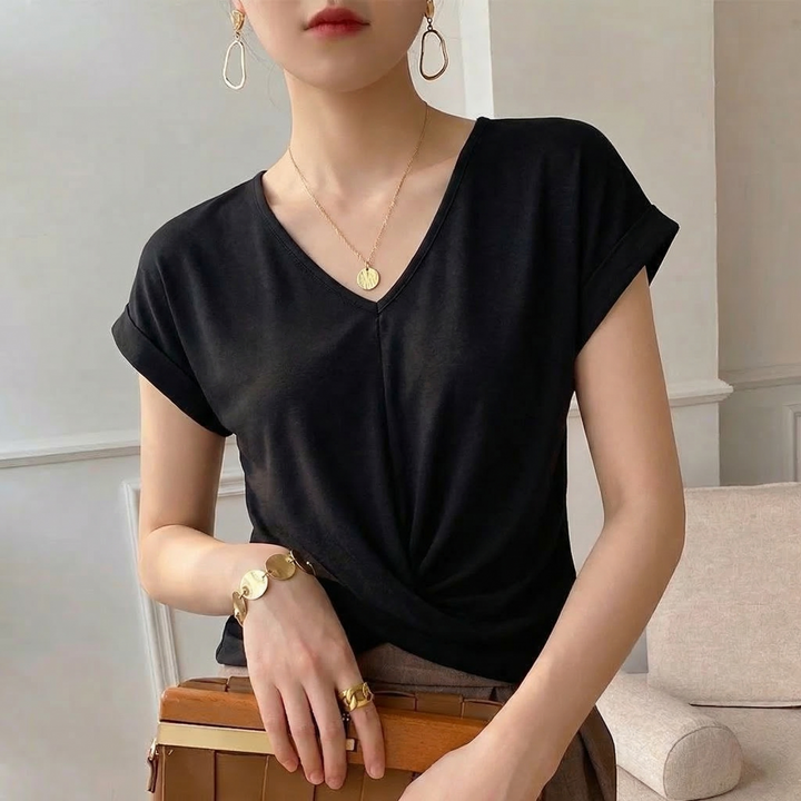 Women's short sleeve V-neck t-shirt with elegant twist front. Chic top for versatile spring and summer casual wear.