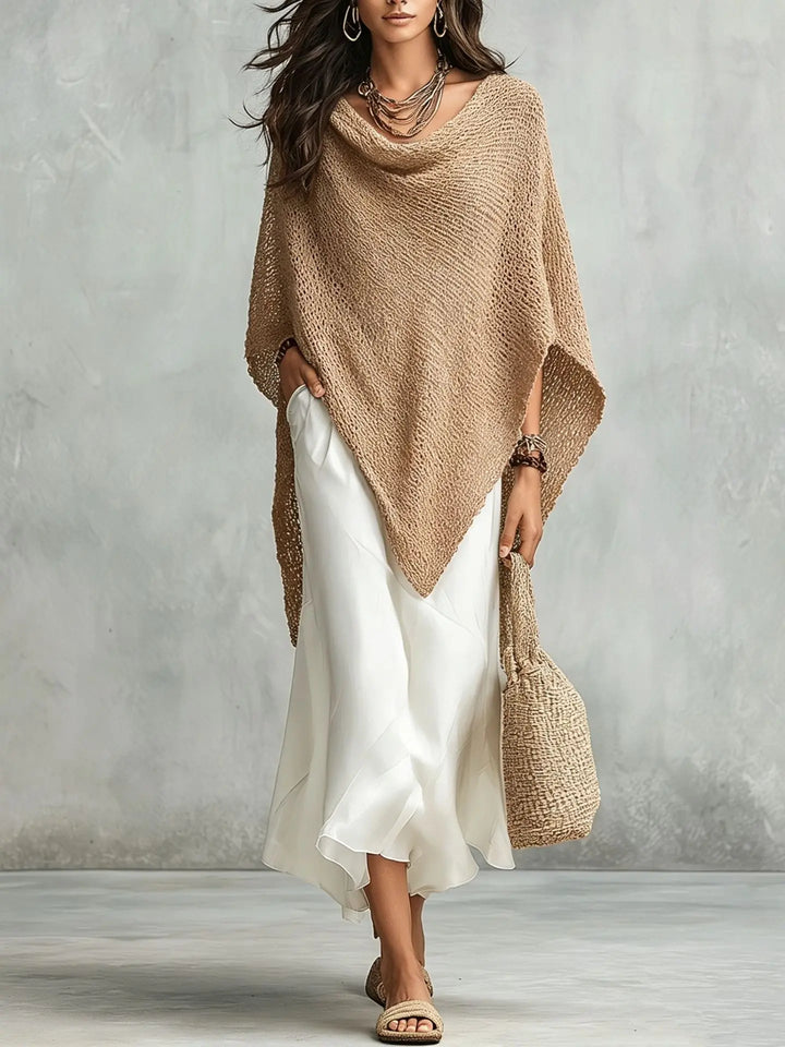 Chic women's poncho maxi dress set. Batwing sleeve top & long sleeveless dress create an elegant, versatile look.