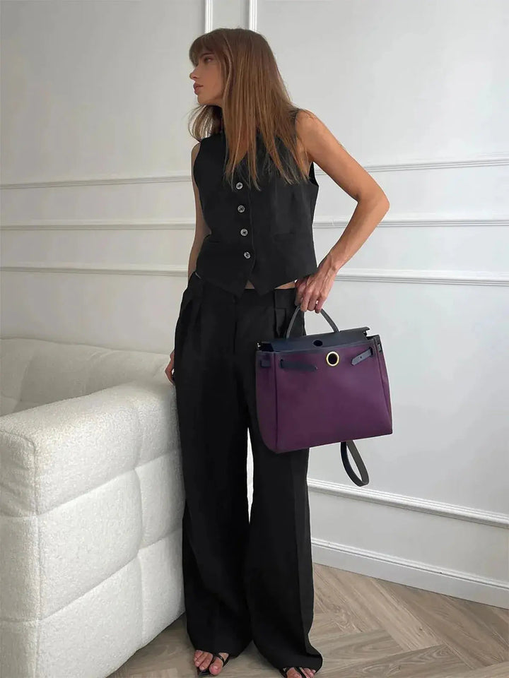 Stylish women's waistcoat and flowing wide-leg trousers set, creating an elegant and comfortable two-piece silhouette.