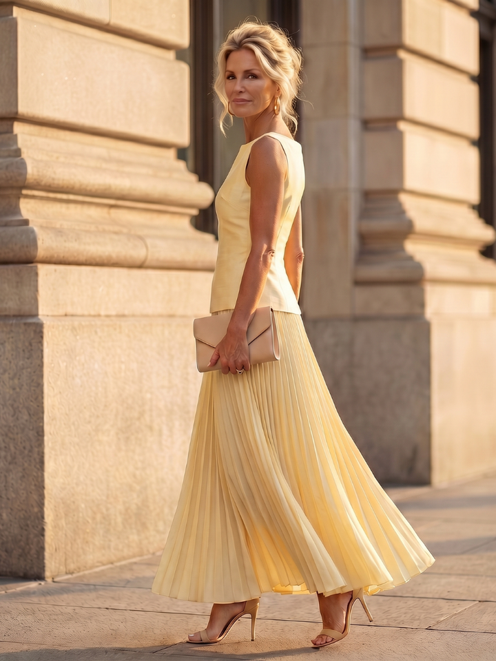 Chic sleeveless top & pleated maxi skirt two piece set for women. Coordinated, stylish summer fashion.