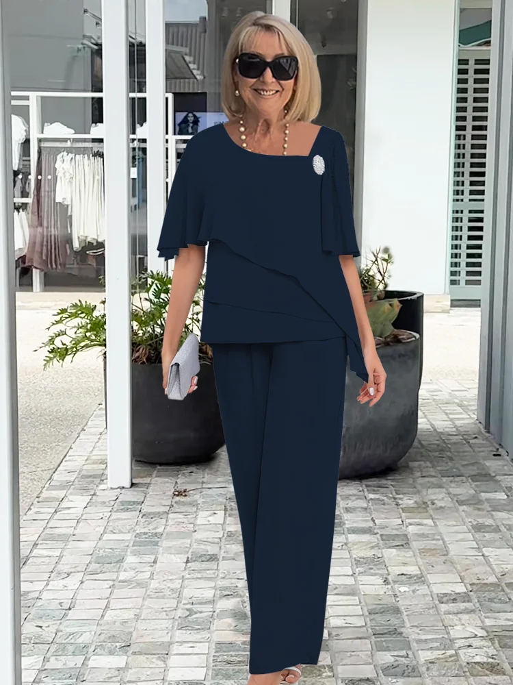 Stylish women's elegant two-piece set: tiered cape top with wide-leg pants for a sophisticated look.