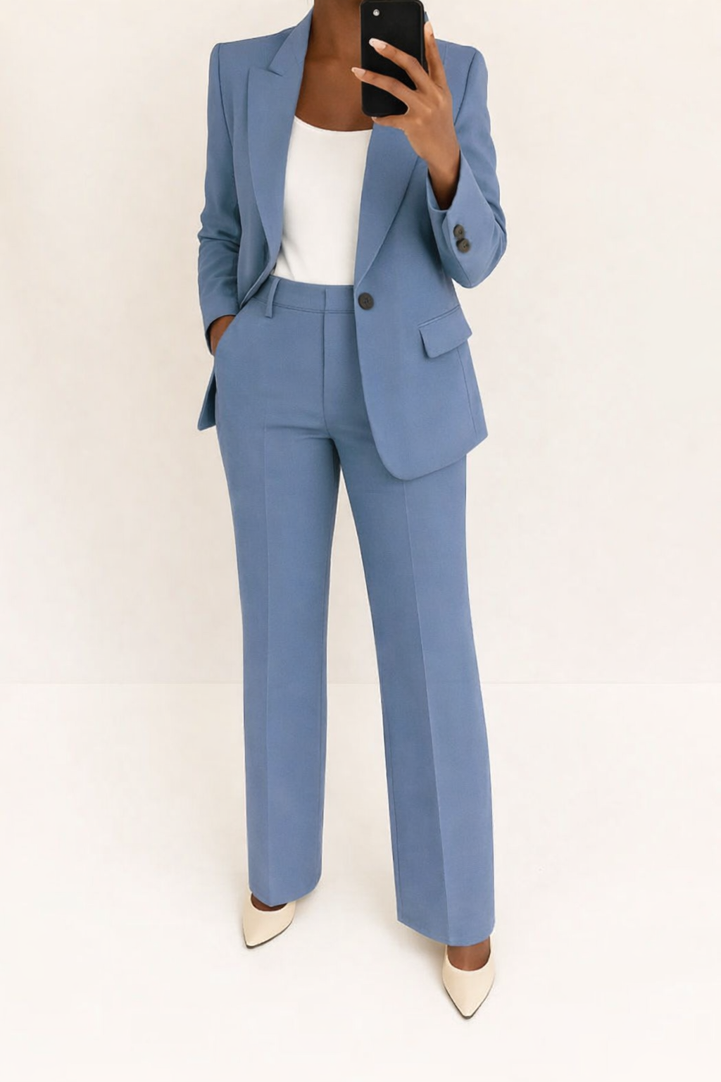 Elegant women's two-piece suit with a tailored blazer and wide-leg pants, perfect for business or formal wear.