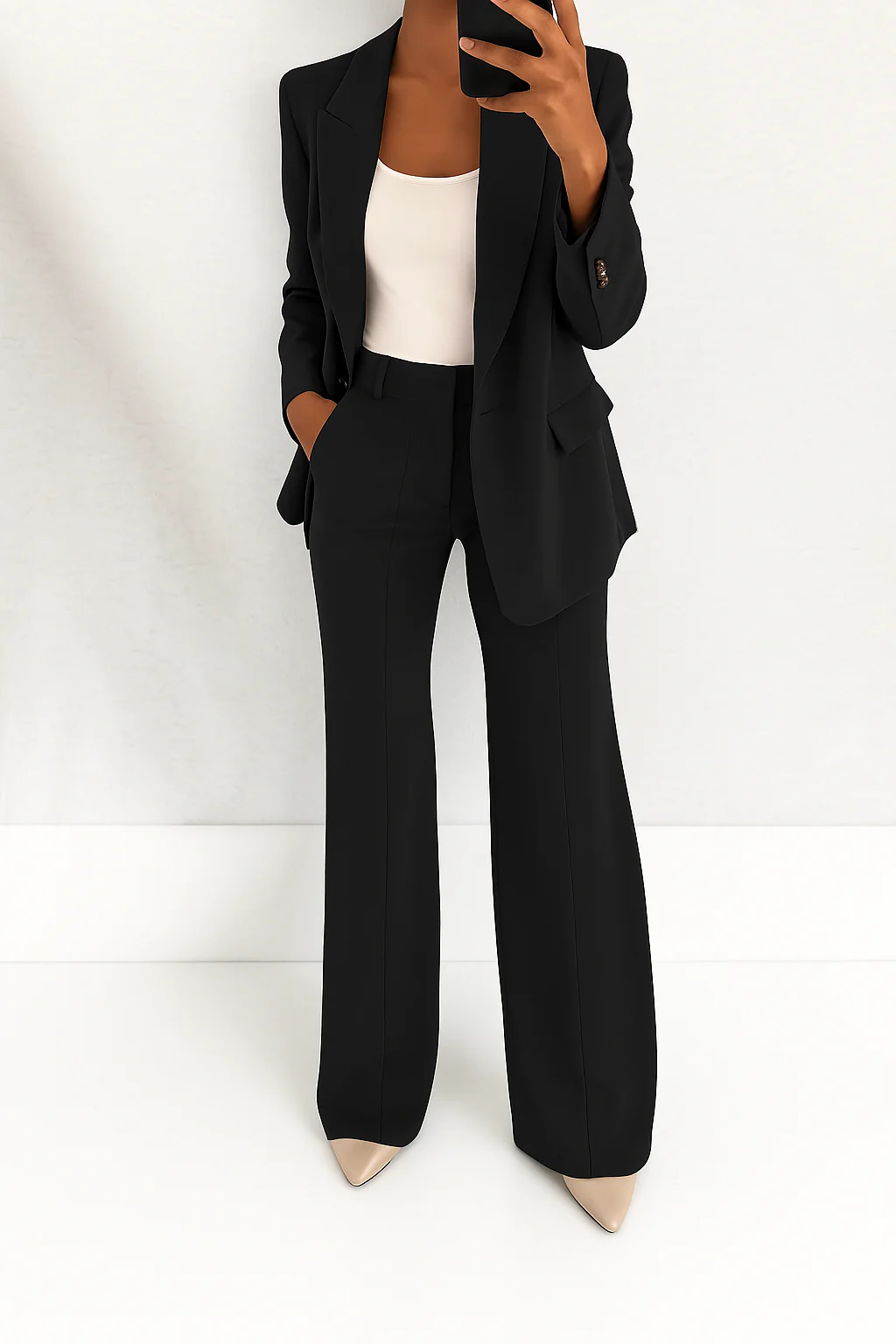 Tailored women's two-piece set, featuring a structured blazer & flattering wide-leg pants for a polished look.