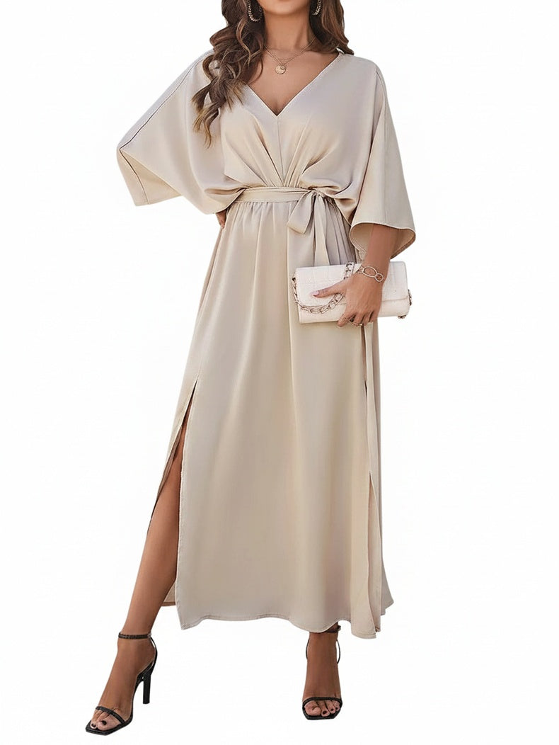Classic black women's V-neck batwing maxi dress, featuring a chic bow belt and an alluring side slit. Formal evening wear.