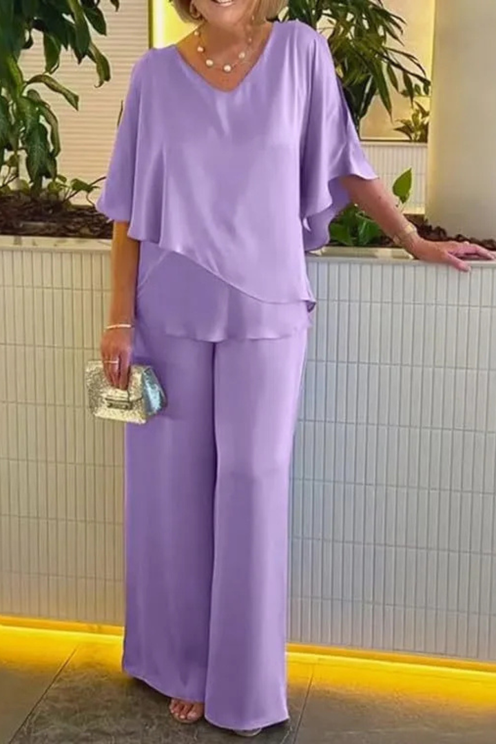 Fashionable women's two-piece outfit with a relaxed batwing V-neck top & elegant wide leg trousers.