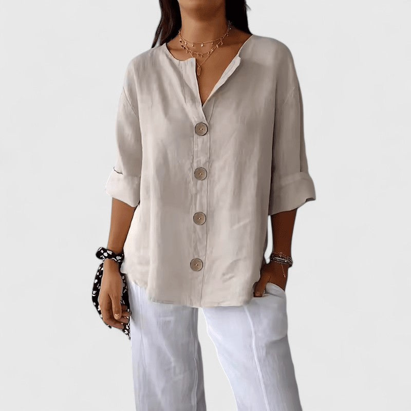 Chic women's V-neck button-down blouse, elegant design with long sleeves, suitable for versatile styling.