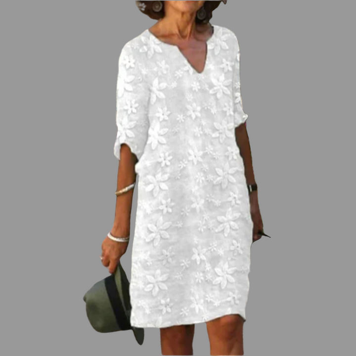 Elegant women's V-neck floral midi dress with elbow sleeves, perfect for spring and summer fashion.