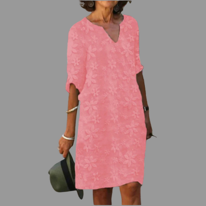 Chic women's V-neck midi dress featuring a vibrant floral print and comfortable elbow sleeves.