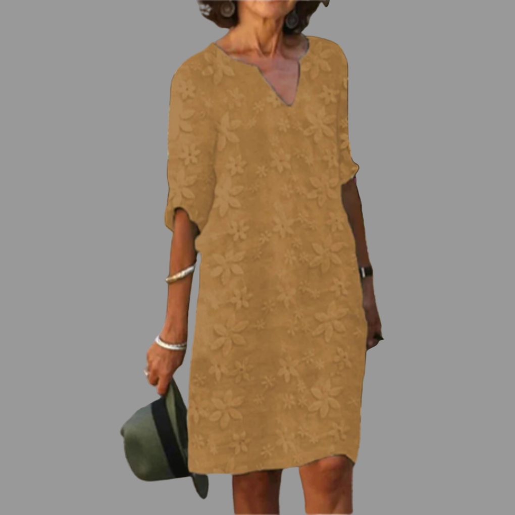 Comfortable women's V-neck floral midi dress with elbow sleeves, a versatile piece for any occasion.