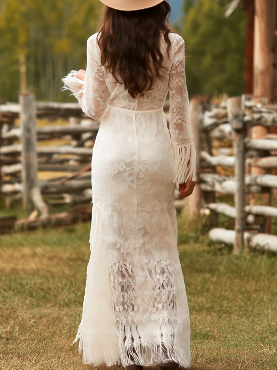 Chic V-neck long sleeve maxi dress with eye-catching fringe hem. Perfect women's formal or special occasion wear.