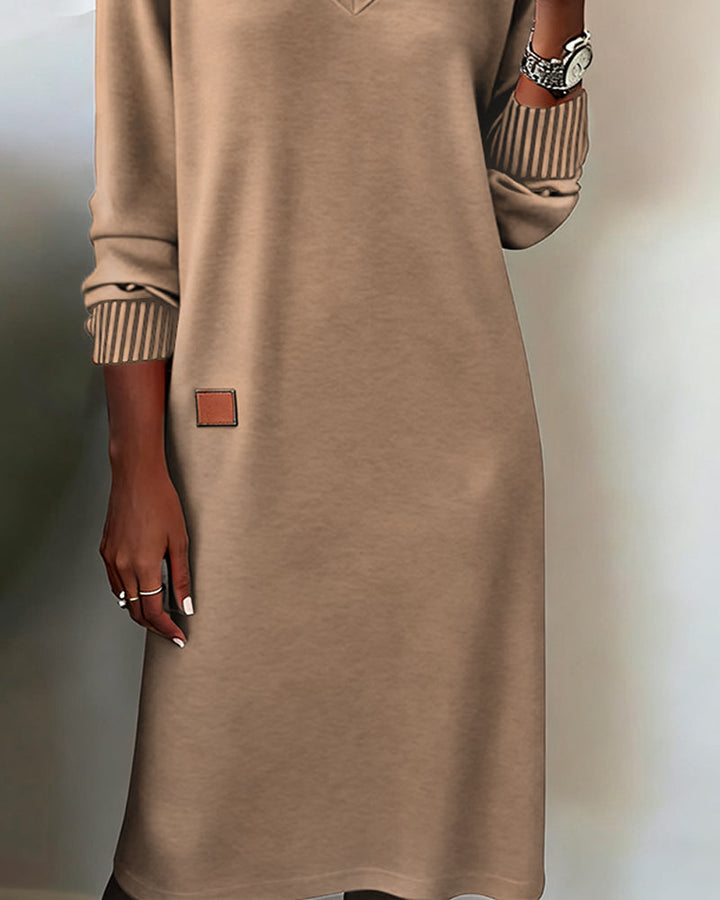Versatile women's V-neck long sleeve midi dress for office & casual. Chic, modest, and perfect for fall/winter.