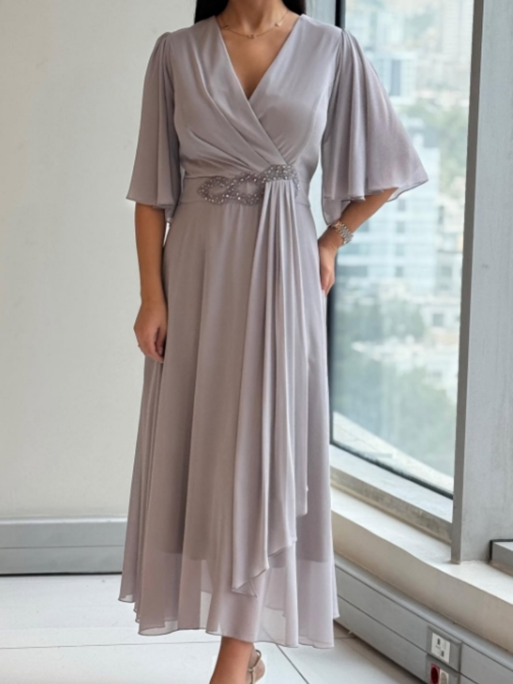 Elegant women's V-neck maxi dress with flowing design and adjustable straps, perfect for summer casual or evening wear.
